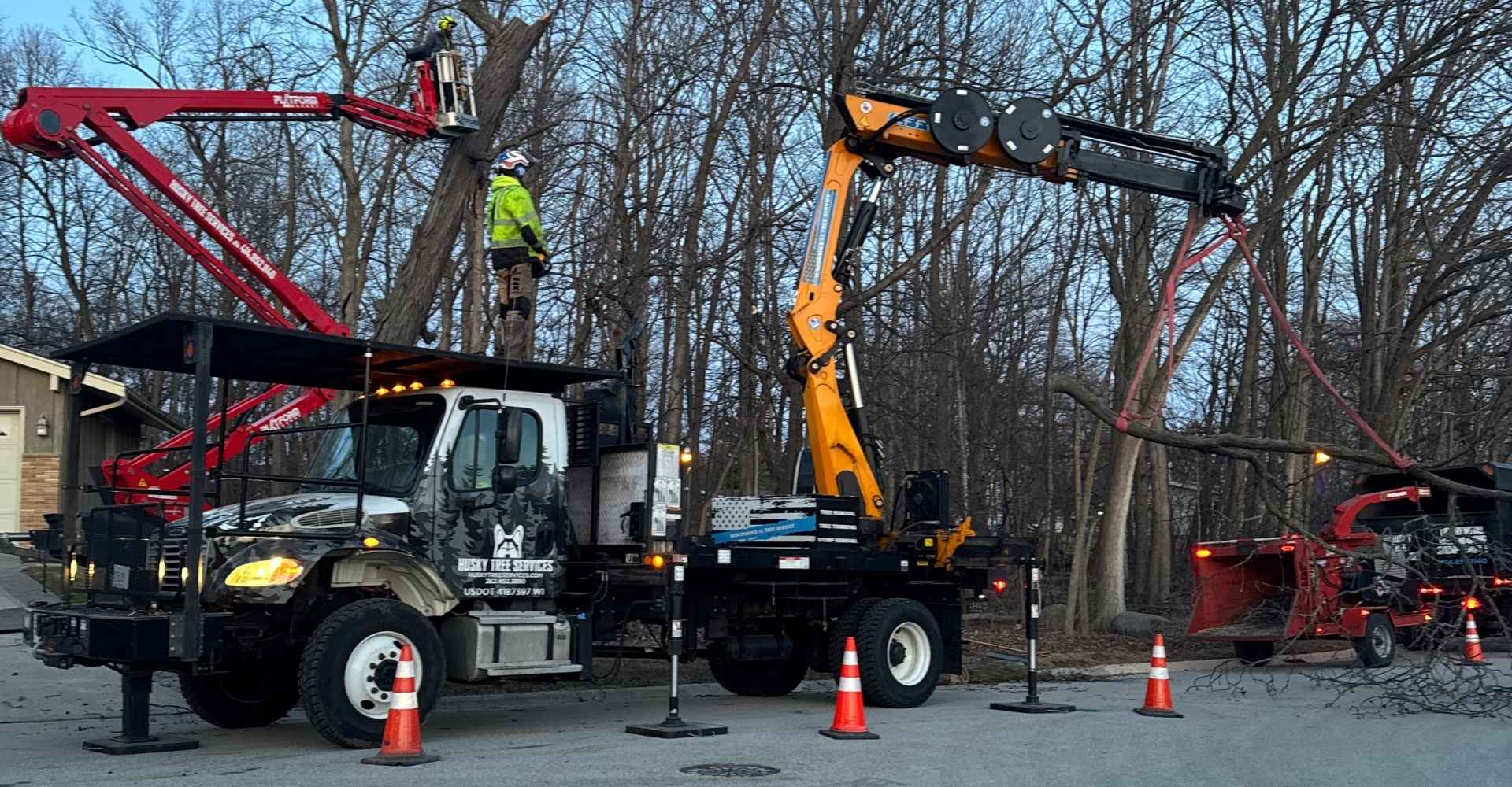 Husky Tree Services crew performing tree removal in Muskego, WI