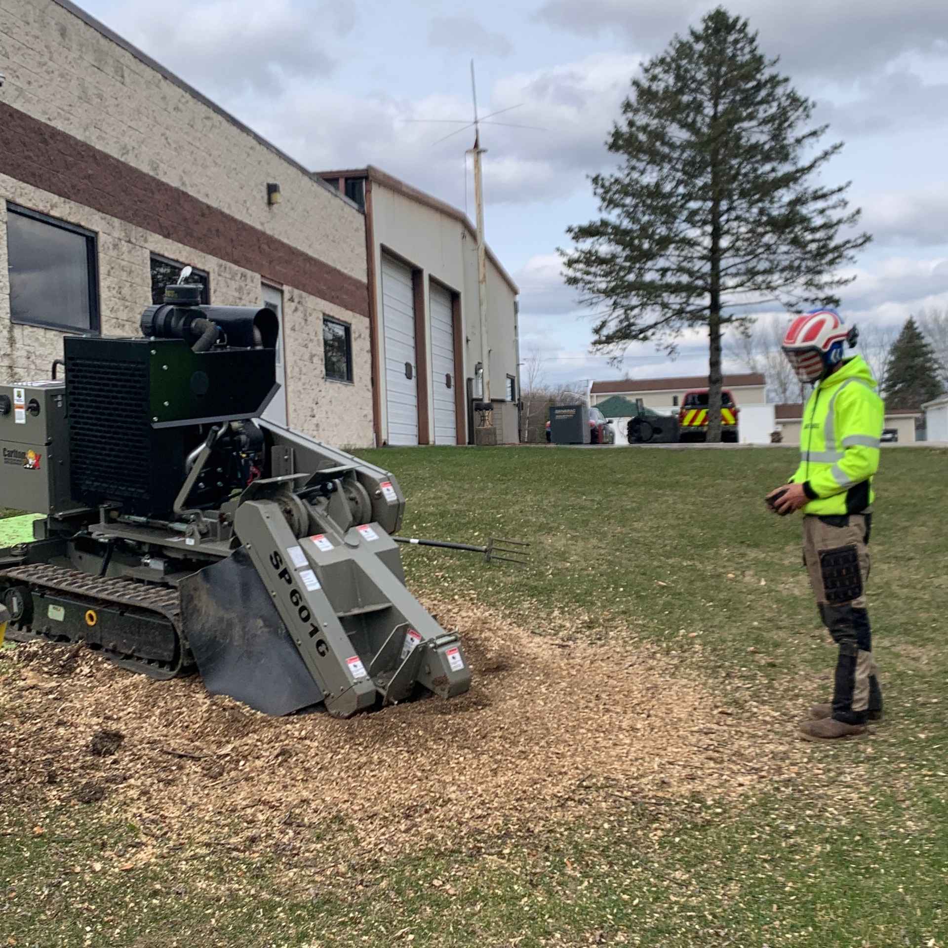 Professional stump grinding service in Southeast Wisconsin using compact grinder – Husky Tree Services
